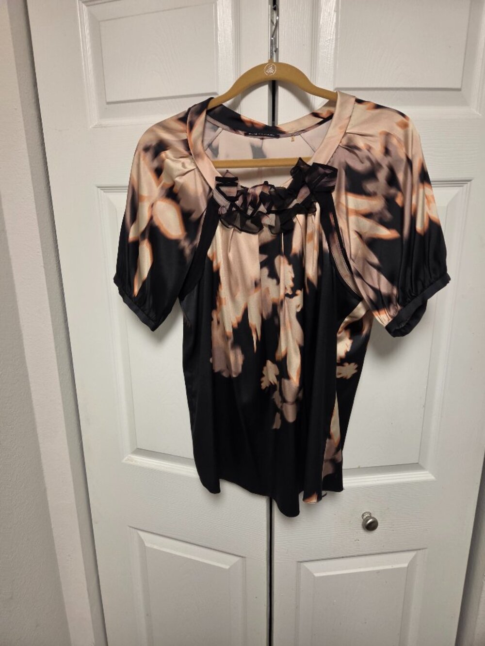 Stunning silk blouse with an unusual print . Light and elegant.